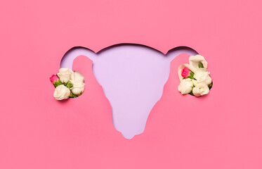 Cut pink paper in shape of uterus with roses on lilac background - obrazy, fototapety, plakaty
