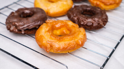 Old fashioned donuts with original and chocolate flavors in the photo in an elegant kitchen