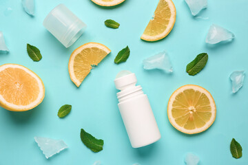 Deodorant with lemon slices, ice and mint on turquoise background