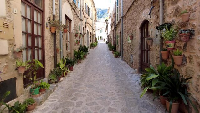 Narrow Street in Valdemossa with green plants, Mallorca