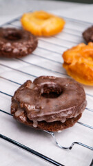 Old fashioned donuts with original and chocolate flavors in the photo in an elegant kitchen