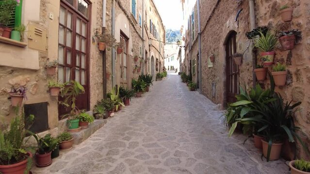 Relaxed walk through a small street in Valdemossa, Mallorca