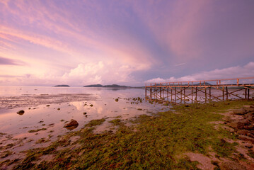 Scene of wooden bridge and clouds during sunrise