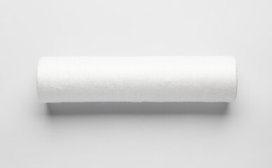 New water filter cartridge on grey background