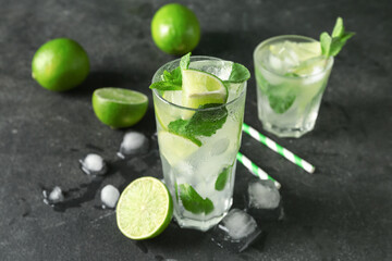 Fototapeta premium Glass of tasty mojito on dark background