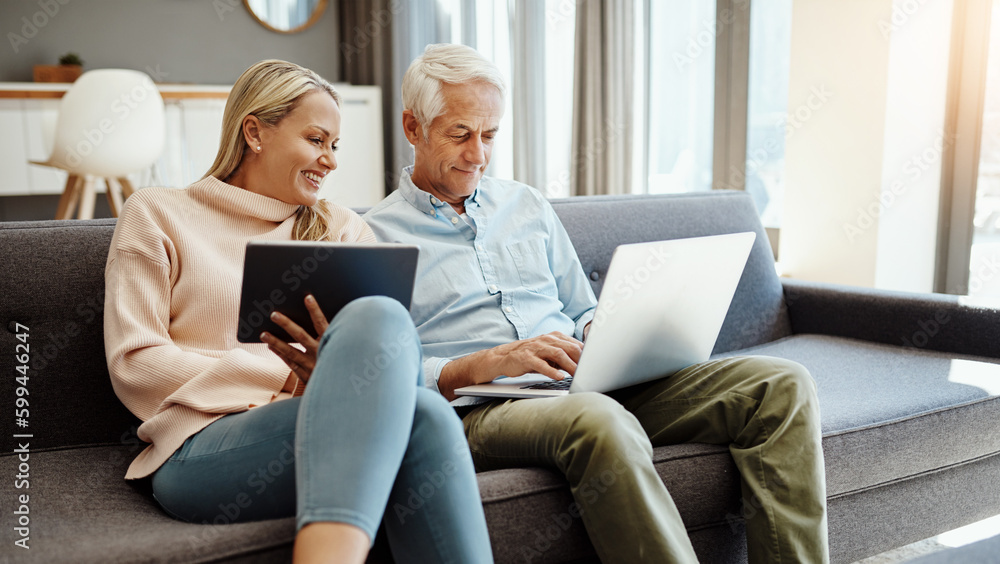 Sticker This is what happens when you save for retirement. a mature couple using a digital tablet and laptop on the sofa at home.