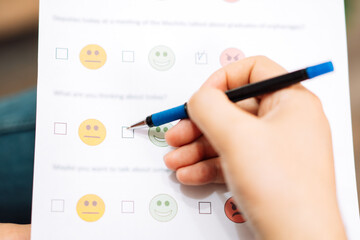 Patient undergoing psychological test with emoticons.