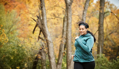 Get going and dont stop. an attractive young woman going for a run in nature.