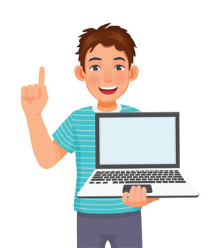 Young man holding laptop with empty screen  pointing finger for copy space