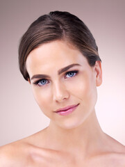 Obraz premium Your skin should be something youre proud of. Studio portrait of a beautiful young woman posing against a pink background.