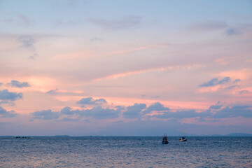 Aerial View of Majestic Sunset Sky: Captivating Colors of a Dramatic Sunrise or Sunset over the Sea, with an Array of Beautiful Clouds and Waves Against a Stunning Background of Purple Hues