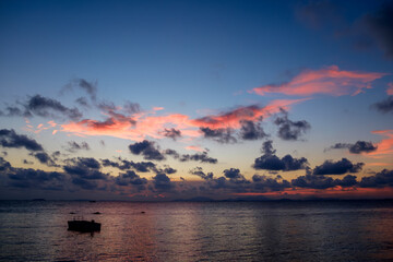 Fototapeta na wymiar Late Evening Sunset on Thai Beach with light shine through the clouds. no tide