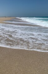 Fototapeta na wymiar Closeup image of sea foam on the beach