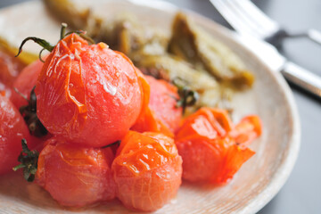 baked tomato and capsicum on plate 