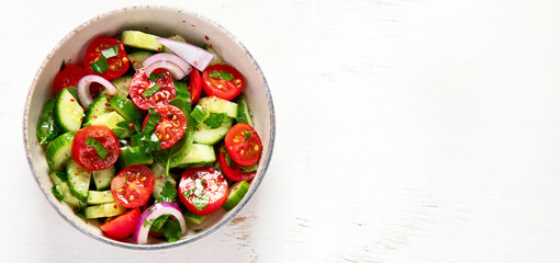 Fresh salad on light background. Top view.