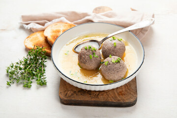 Knodel soup bowl and bread.