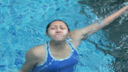 Blurred video, woman drowning due to leg cramps