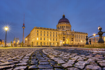 The Berlin City Palace at night photographed from a low angle