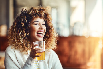 The weekend is served. a young woman enjoying a drink at a bar.
