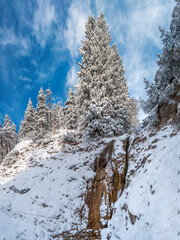 Bavarian Mountain hike to the Herzogstand peak with snow and sun 