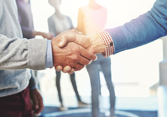 Closeup, hand shake and agreement for partnership in office with welcome, onboarding or b2b...