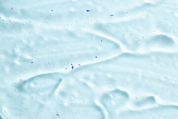 Cosmetic gel close-up with oxygen bubbles. Textured background with microbrushes in cosmetics. Moisturizing skin serum with vitamins and collagen.
