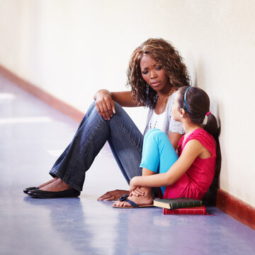 Teacher, Child And Talking Or Conversation At School For Support, Trust Or Counselling. Serious Black Woman Working At School For Student Discussion Or Education On Bullying, Abuse Or Problem