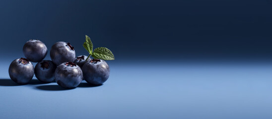 Wide short of a bunch of blueberries on a gradient background, commercial shoot, photorealism, mockup, copy space - Powered by Adobe