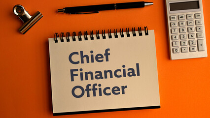There is notebook with the word Chief Financial Officer.It is as an eye-catching image.