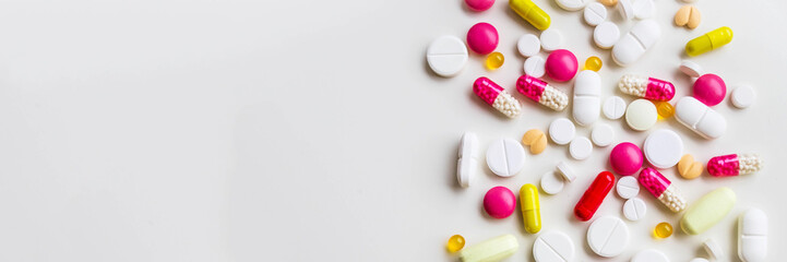 Frame of colorful antibiotic capsule pills. Antibiotic drug resistance concept. Pharmaceutical...