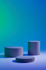 Abstract background for branding and minimal presentation with three round cylinder podiums displayed on gradient blue background. Front view, copy space for design