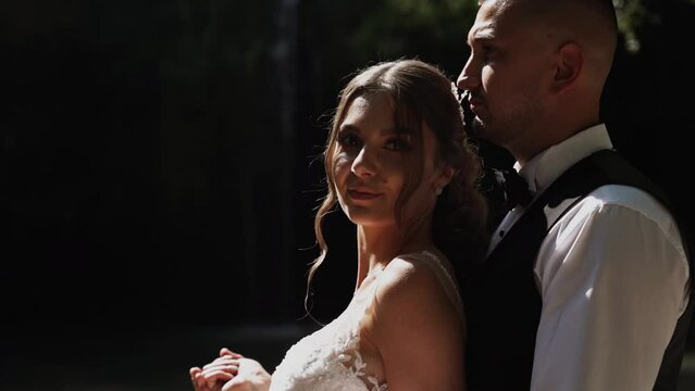 Young couple in love bride and groom, wedding day near a mountain waterfall. Enjoy a moment of happiness and love