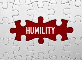Fototapeta premium Word Humility on red puzzle background