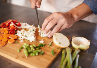 Chopping board, hands and man with vegetables, closeup and prepare a healthy meal at home. Zoom,...