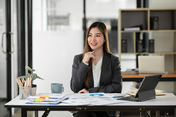 Asian business woman Working at the office, happy working day smile