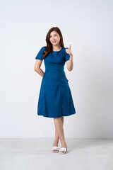 Asian girl portrait in blue dress on white background