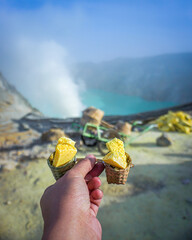 The lumps of sulfur that have been formed resemble baskets carried by miners