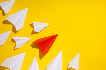Business, startup and sponsorship concept with paper planes on yellow background