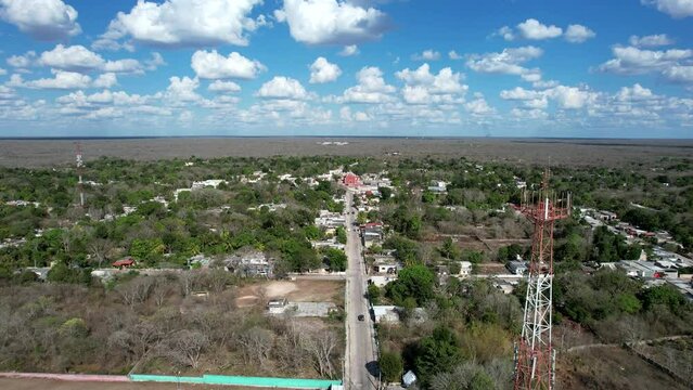drontal aerial shot of town of tahmek and baseball camp at yucatan during hewavy drought