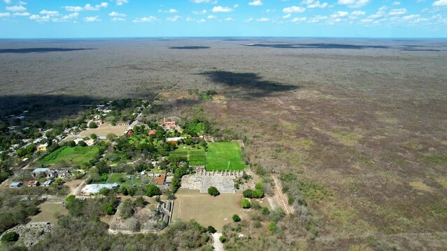 aerial shot of abandoned mayan ruins of ake yucatan mexico in a very sunny dayu