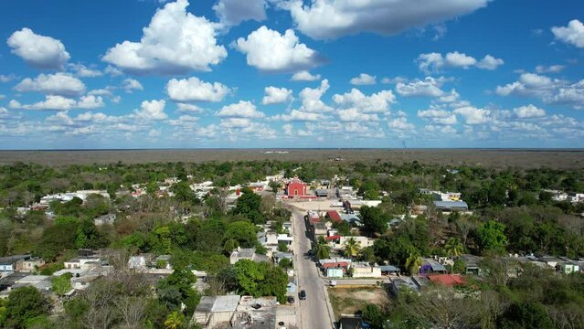 backwards drone shot of ancient church at tahmek yucatan mexico during a very sunny day