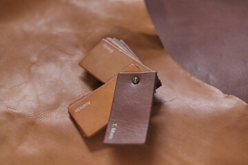 selection of top-notch beige leather cuts in different shades, demonstrating the range of colors available for designers and artisans. color grading and matching in leather industry. Grading the Hues