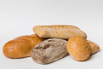 Homemade natural breads. Different kinds of fresh bread as background, perspective view with copy space