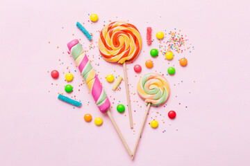 Tasty appetizing Party Accessories Happy Birthday Sweet. Different types of candies on colored...