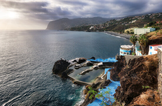 Ocean dramatic sunset over Doca do Cavacas, natural pools in Madeira. Portugal