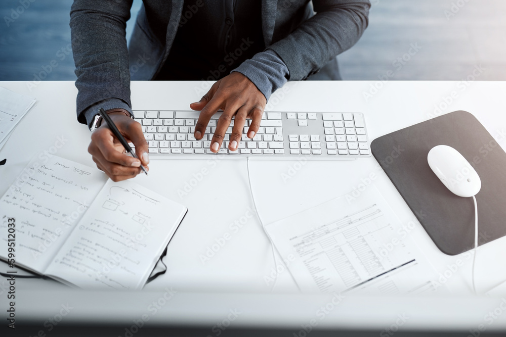 Aufkleber multi-taskers stay on top of work. high angle shot of a businessman using a computer and writing not