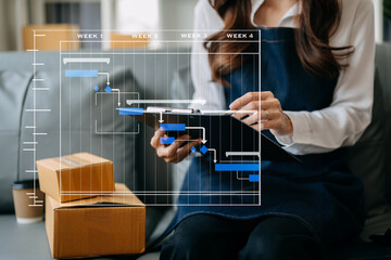 Fototapeta premium Woman hand using a laptop, smartphone and tablet and writing notebook at the office of her business online shopping. In home