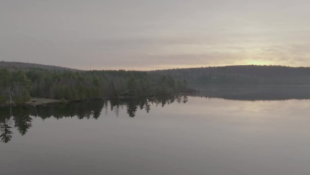 Calm morning sunrise over Monson Pond