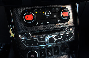 Car climate control. Detail air conditioning button inside a car. Car interior detail. Closeup image of air control panel inside of the car.