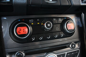 Car climate control. Detail air conditioning button inside a car. Car interior detail. Closeup image of air control panel inside of the car.